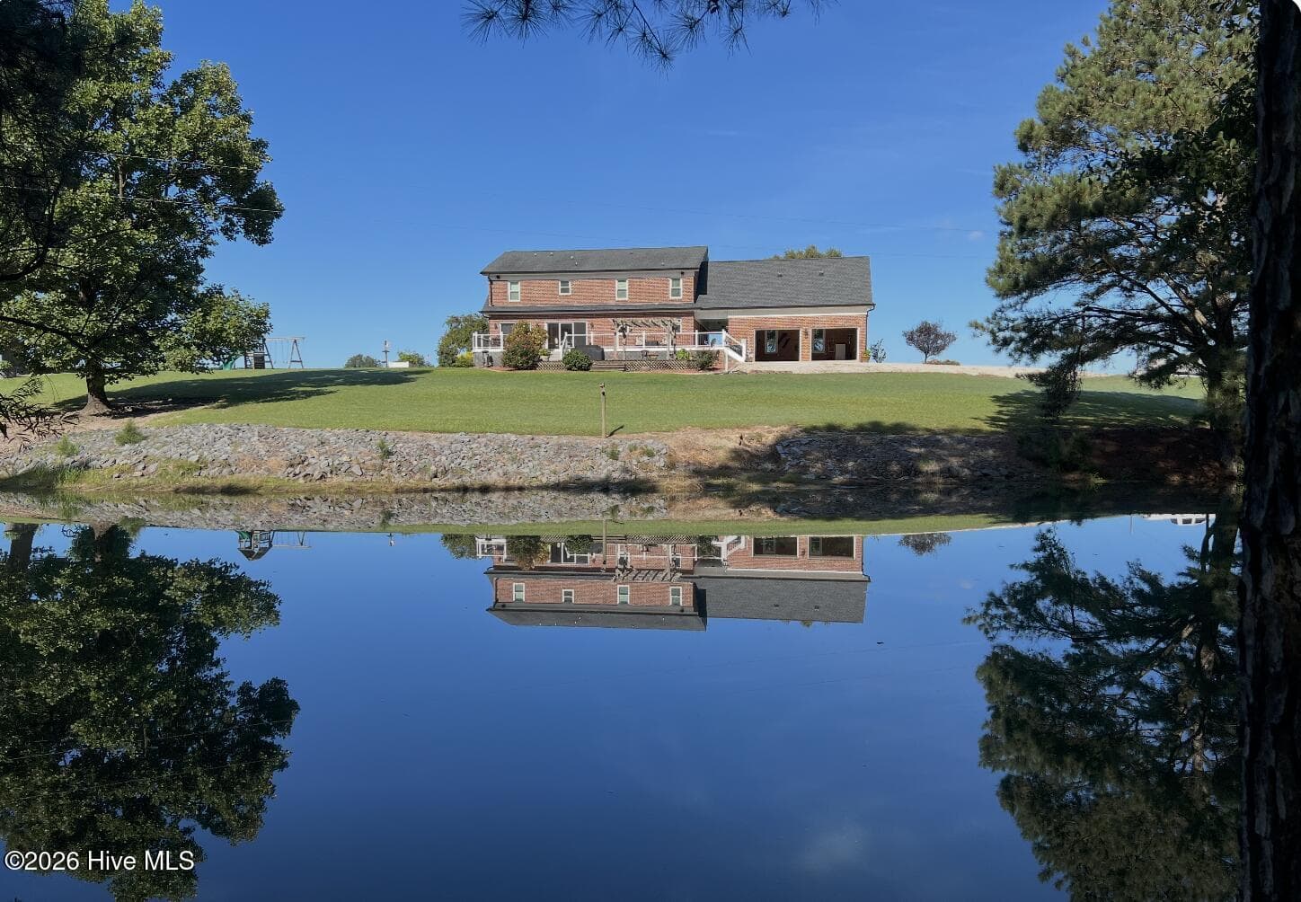Rear View of house from Pond Dam. - 642 Enoch Road, Clinton, NC 28328