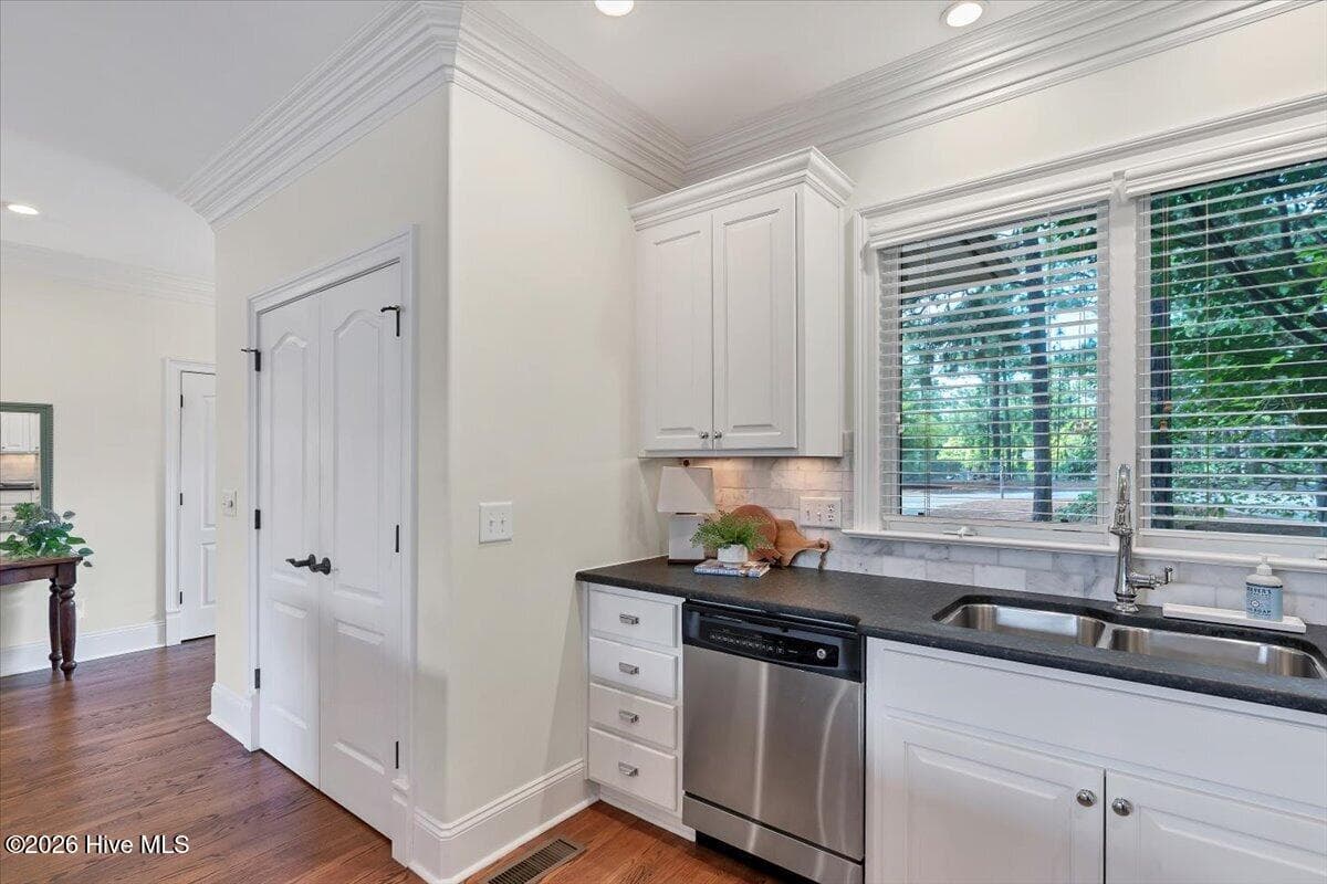 Ample windows allow light to flow beautifully throughout the home's open spaces. - 150 Cochrane Castle Circle, Pinehurst, NC 28374