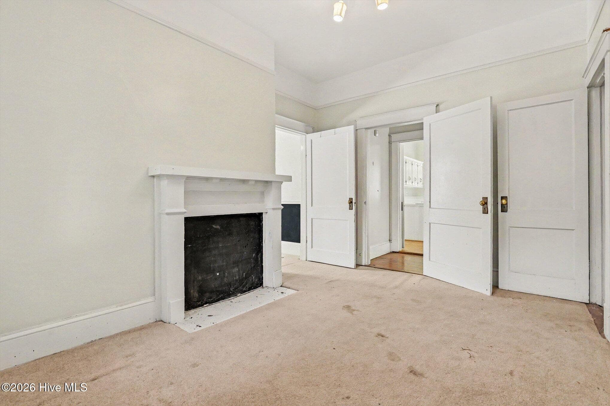 Bedroom 3 with fireplace. Condition of FP is unknown. - 202 N Green Street, Selma, NC 27576