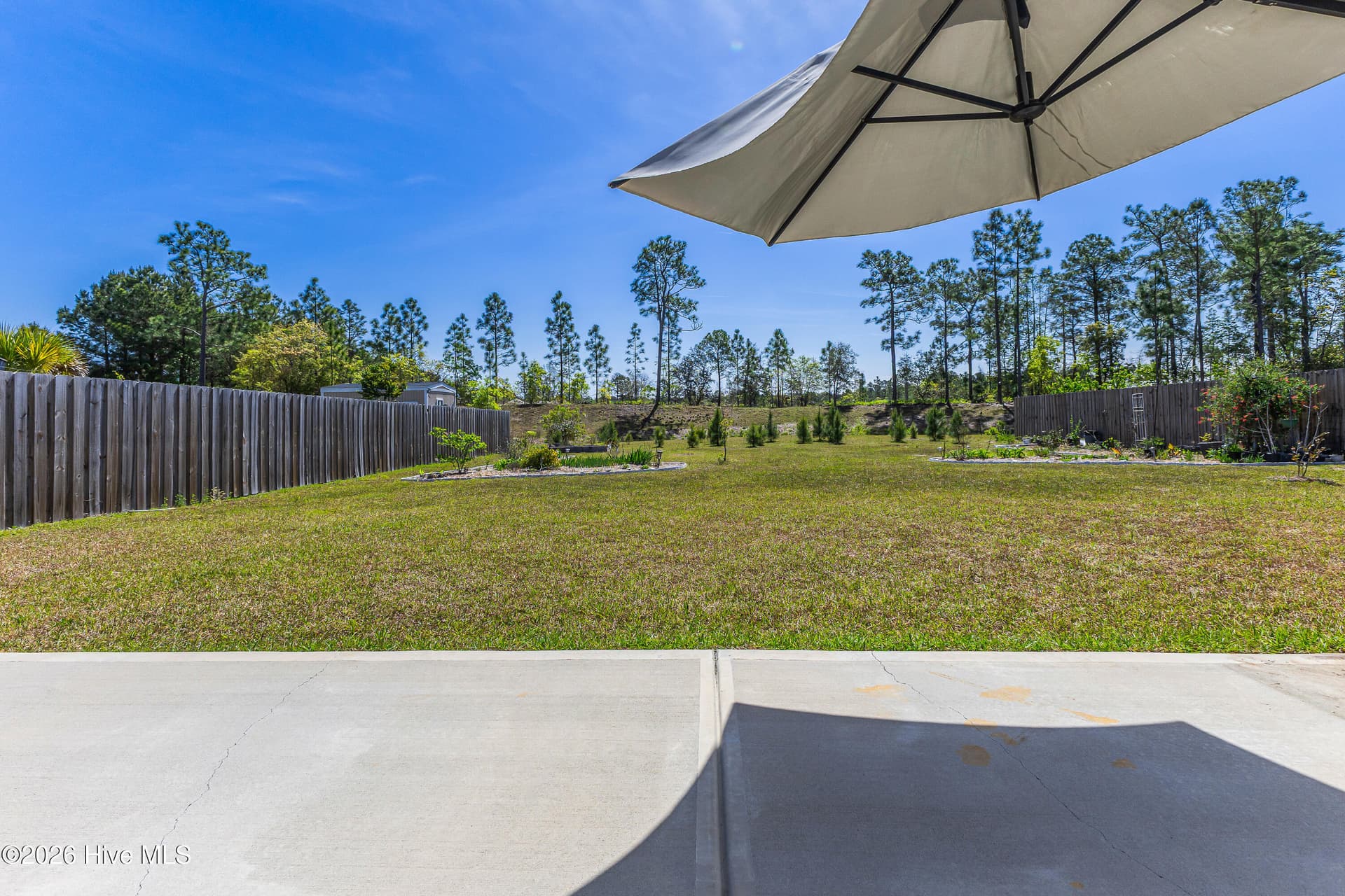 Extra patio great for grilling or soaking up the North Carolina Sun - 1038 Burled Oak Ridge Loop SE, Bolivia, NC 28422