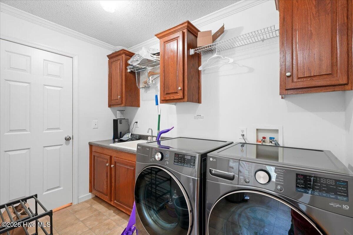 Laundry Room with Sink and Storage. - 303 Wood Street, Goldsboro, NC 27534