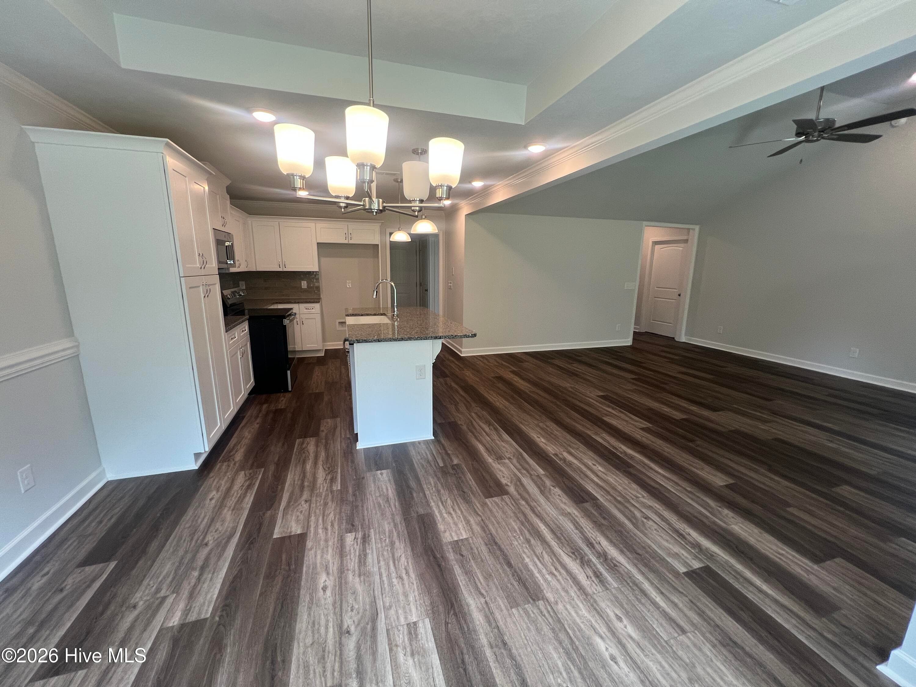 looking into the kitchen and great room from the dining area. - 8887 Snelling Drive, Aiken, SC 29803