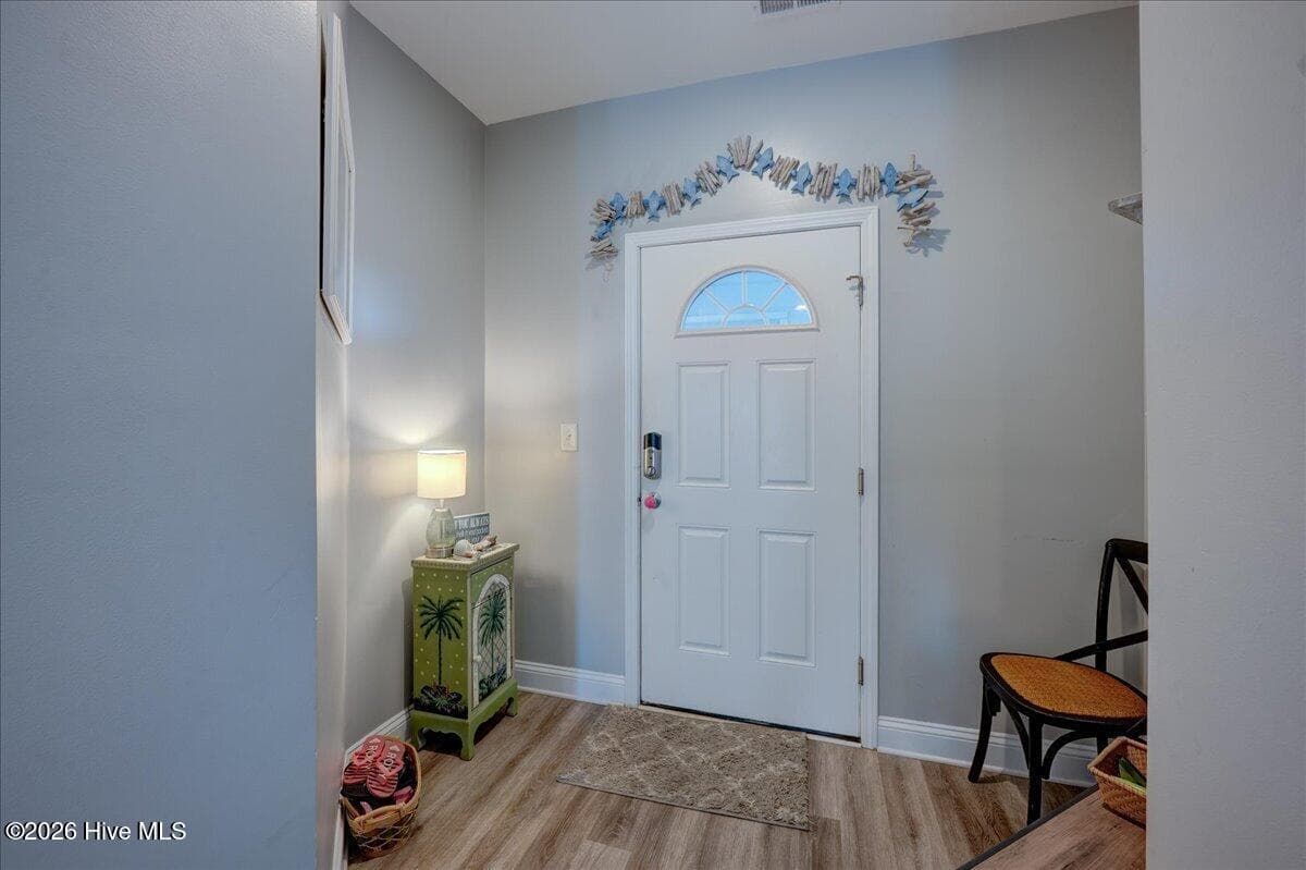 Looking back to the front door, small foyer/drop zone - 104 Pelican Drive H, Atlantic Beach, NC 28512