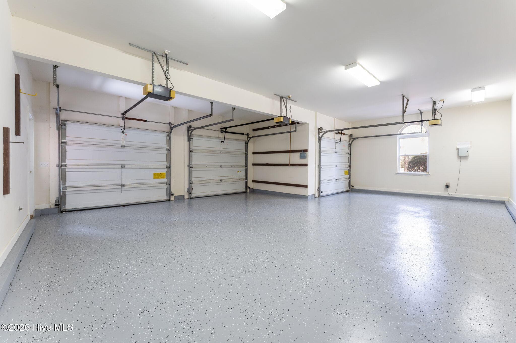 3 garage doors. Newly applied epoxy flooring. - 22 Lochmere Drive, Pinehurst, NC 28374