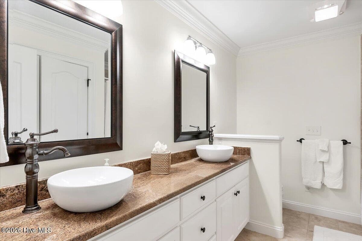 Updated bathrooms with dual sinks - 150 Cochrane Castle Circle, Pinehurst, NC 28374