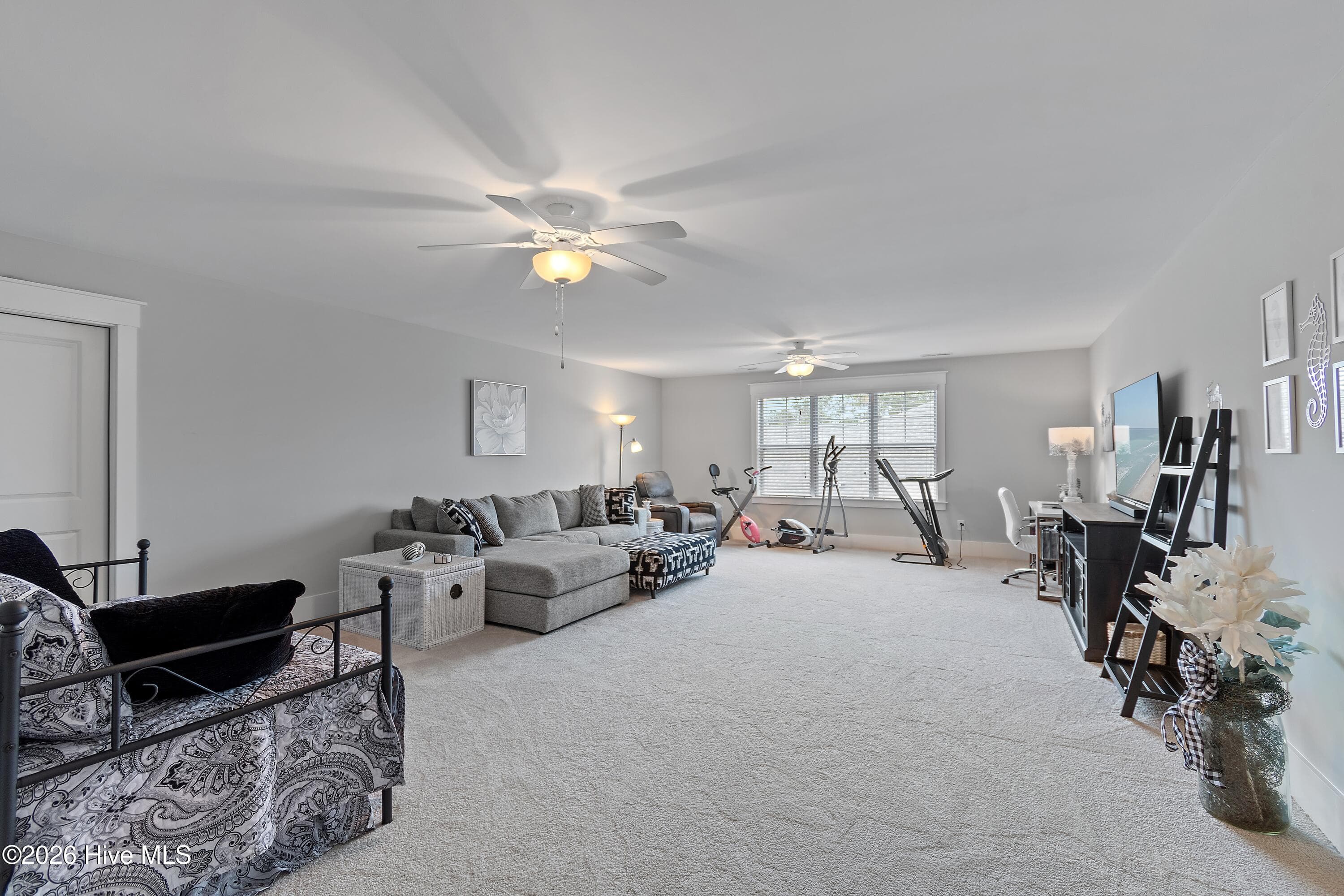 Upstairs bonus room. This room is large enough to be used as a family room, home gym, playroom, home office or any combination! - 6358 Bryson Drive SW, Ocean Isle Beach, NC 28469