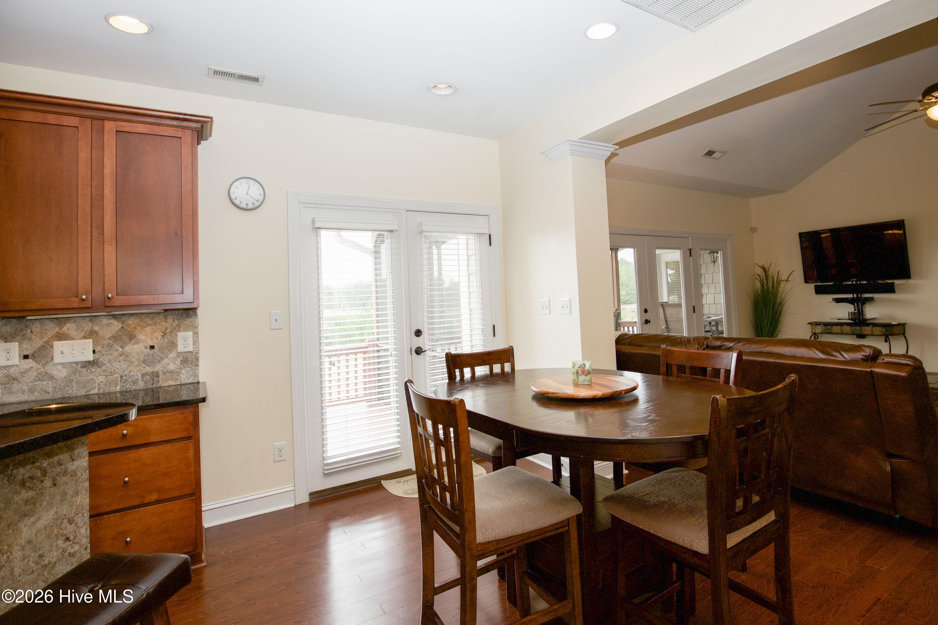 Breakfast area with a door to the deck and an open view to the living room. - 899 Seagull Drive, Vass, NC 28394, Vass
