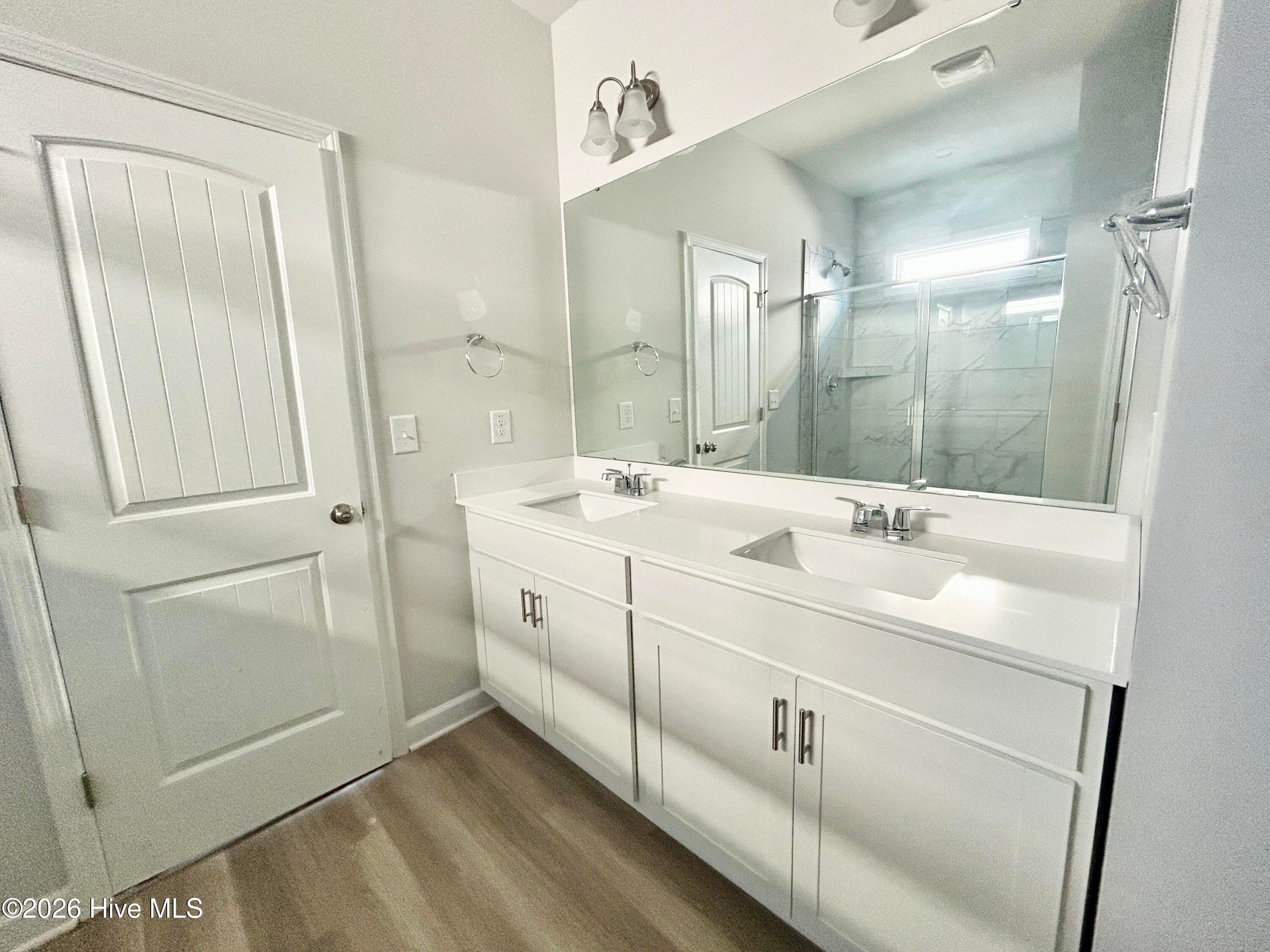 Primary suite features a Private Bathroom with Tile Shower and Large Walk-in Closet - 4208 Workman Loop 94, Leland, NC 28451