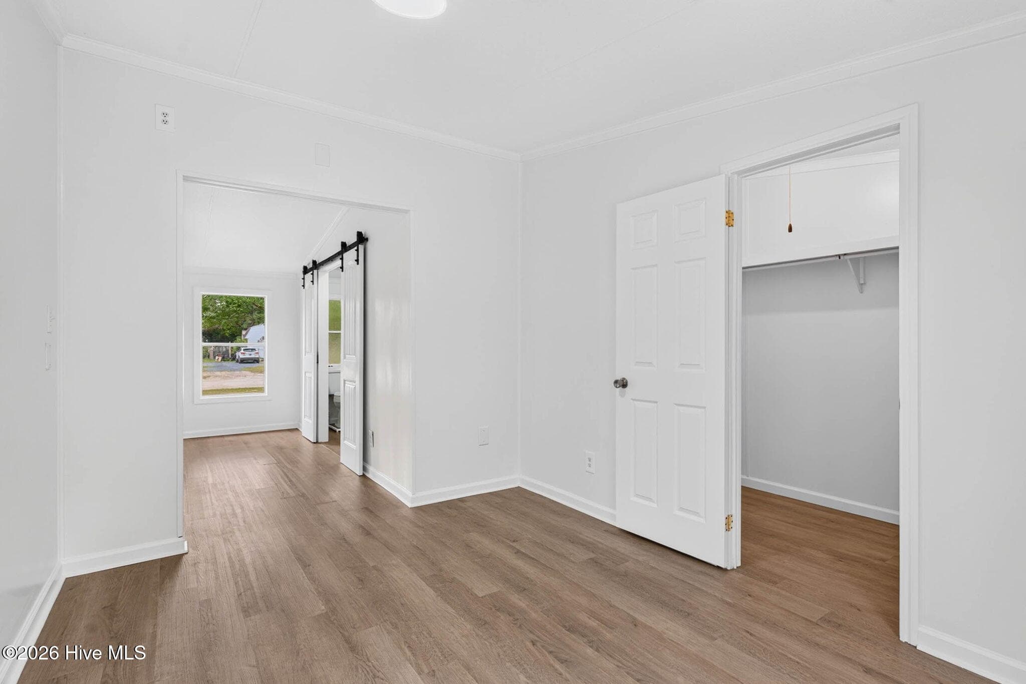 A unique flex space within the primary suite is perfect for a reading nook, home office, nursery, or private sitting room. - 1199 Zack Street SE, Bolivia, NC 28422