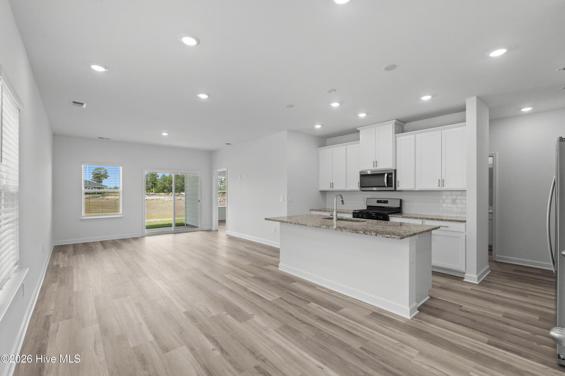 Photo is not of the actual home, but is an example photo of a completed home and may depict options and/or features that are not included - 2217 Lewis Allen Crossing NW, Ash, NC 28420
