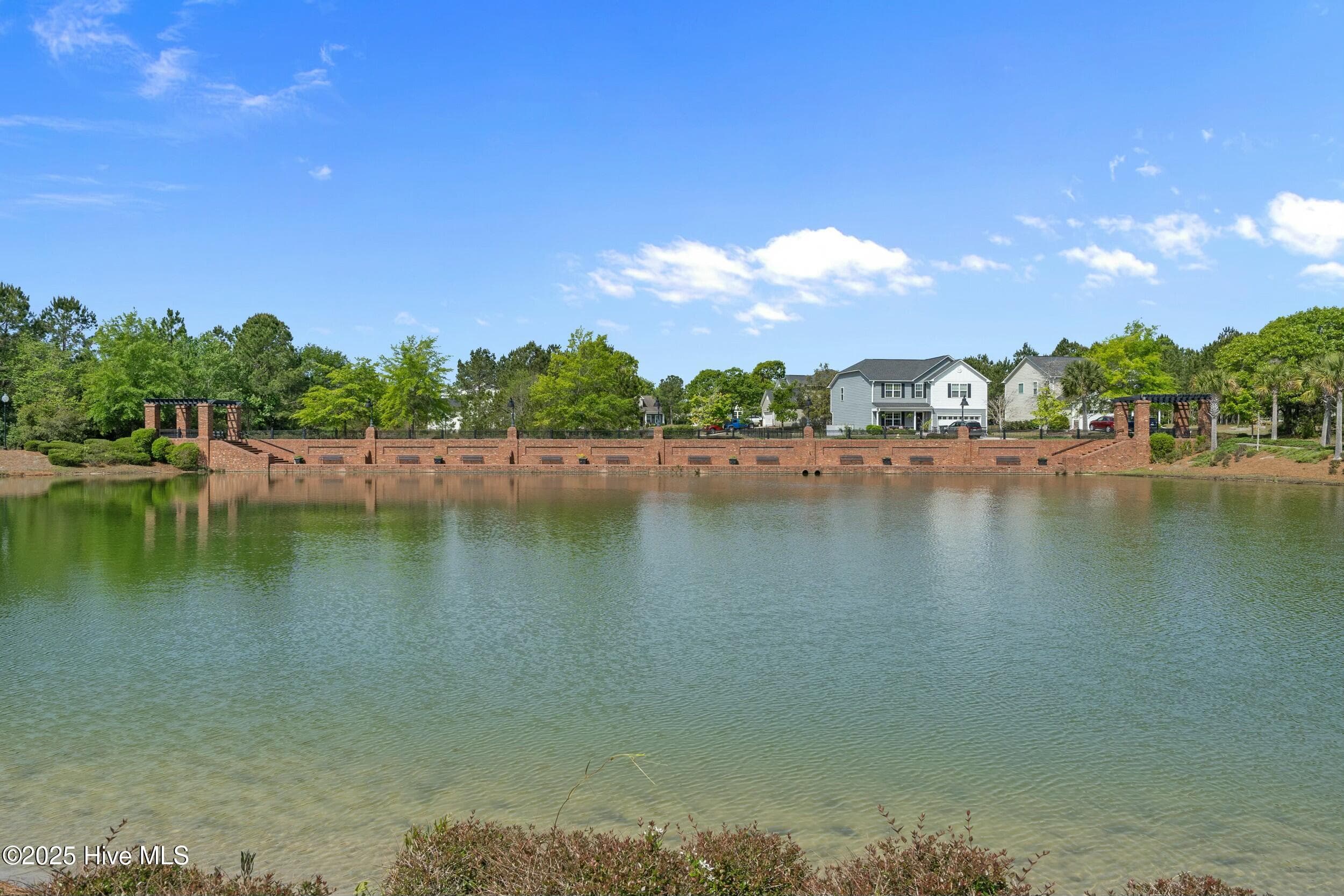 As you enter the community, you'll be welcomed by stately brickwork, classic streetlamps, picturesque bridges, and serene ponds that create an inviting atmosphere. - 3088 130 Brackenbury Street SW, Shallotte, NC 28470, Shallotte