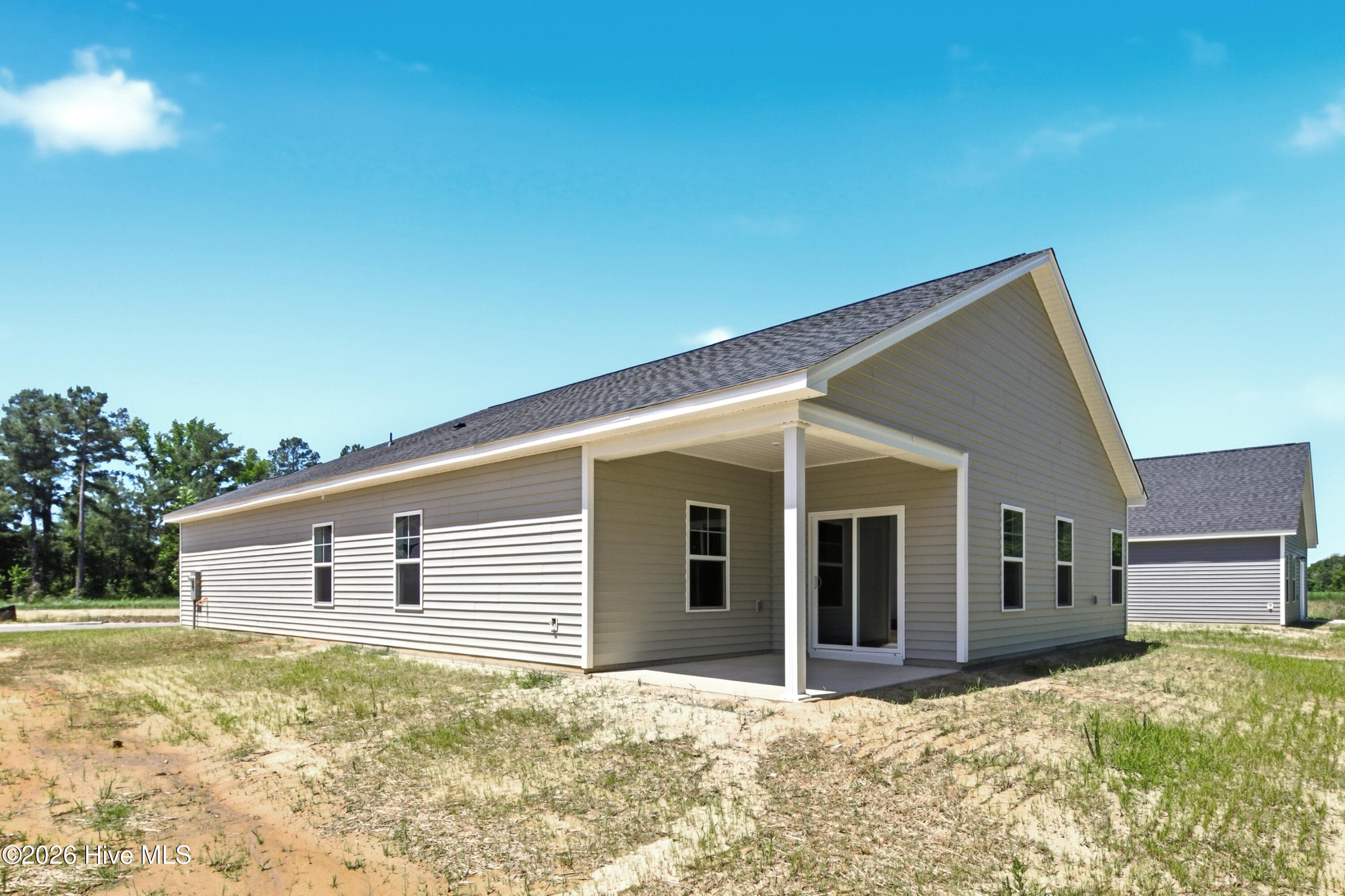 Example photo of similar home. Actual home is under construction and will feature a rear, screened-in, covered porch. - 4149 Workman Loop 67, Leland, NC 28451