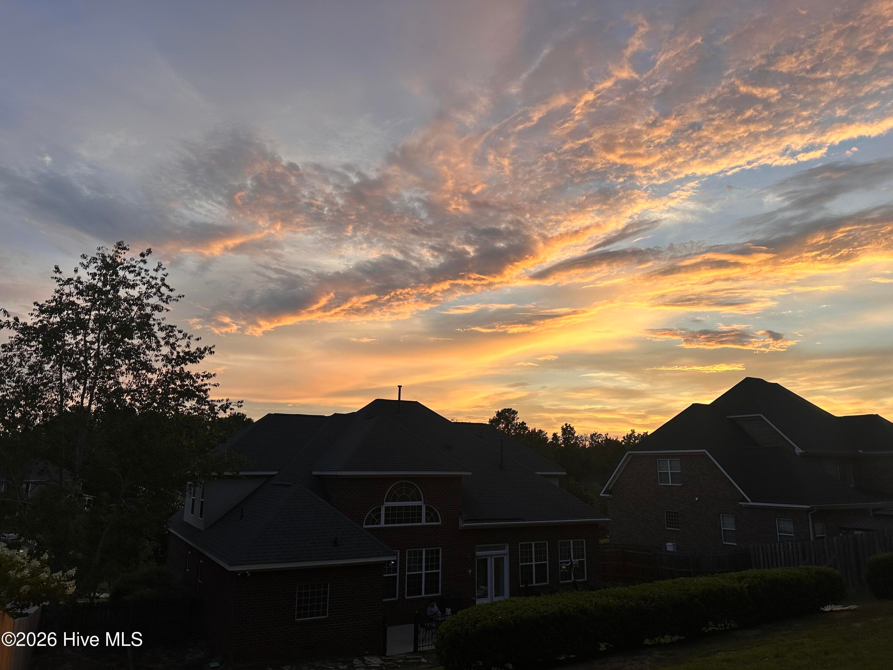 Stunning sunset views from the top of the backyard overlooking the neighborhood - 1118 Blackfoot Drive, Evans, GA 30809