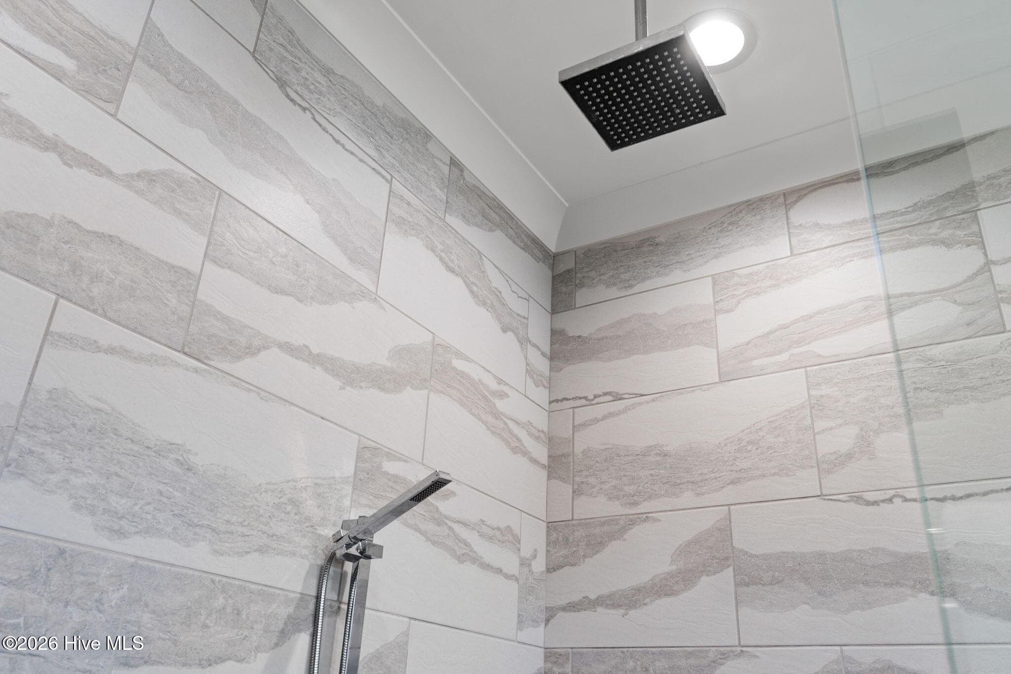 Shower features two shower heads - a rain showerhead and a hand held head - 2775 Long Bay Drive SE, Southport, NC 28461
