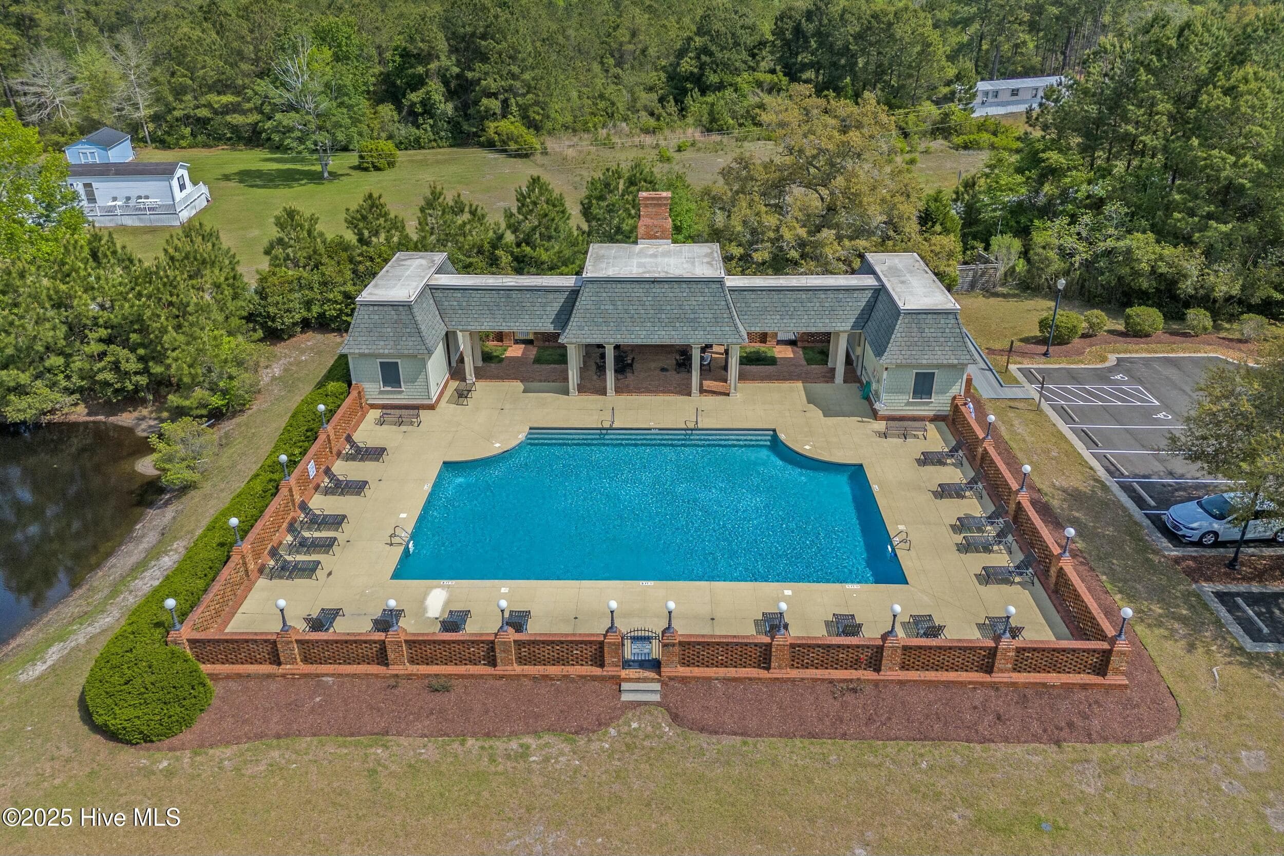 Enjoy days spent swimming or lounging by the pool, unwinding under the gazebo by the pond, or staying active with tennis and pickleball. - 3088 130 Brackenbury Street SW, Shallotte, NC 28470, Shallotte