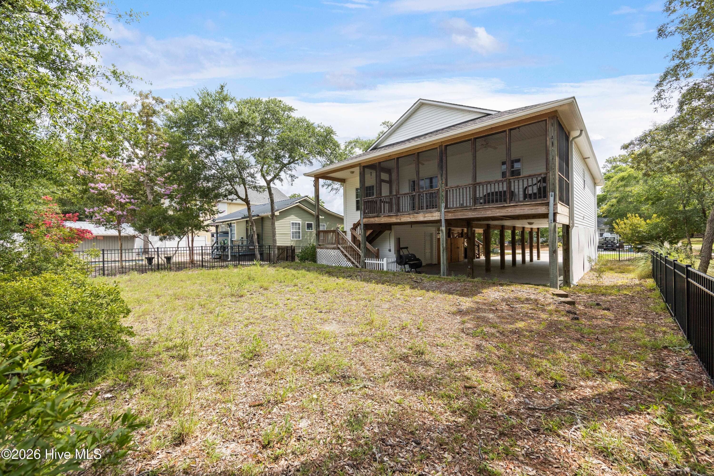 BACK YARD overlooked by Screened Porch - 225 NE 39th Street, Oak Island, NC 28465