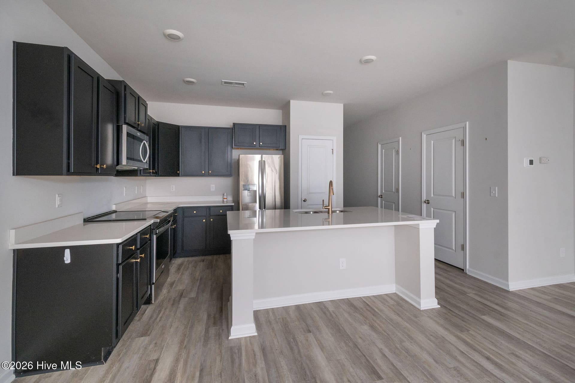 Kitchen from the Dining Room area - 7619 Knightbell Circle, Leland, NC 28451