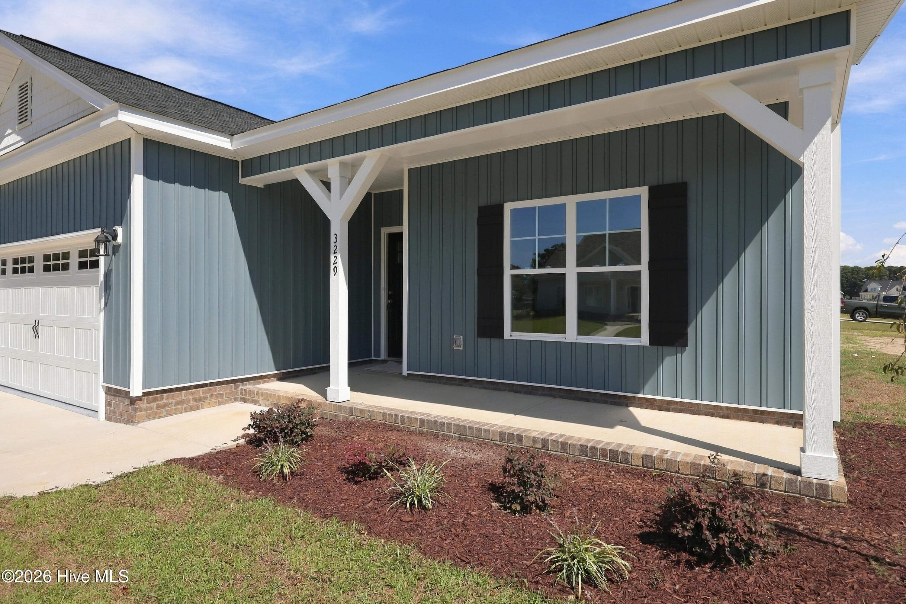 darling rocking porch and easy to maintain vinyl siding - 3229 Meadow Drive, Farmville, NC 27828
