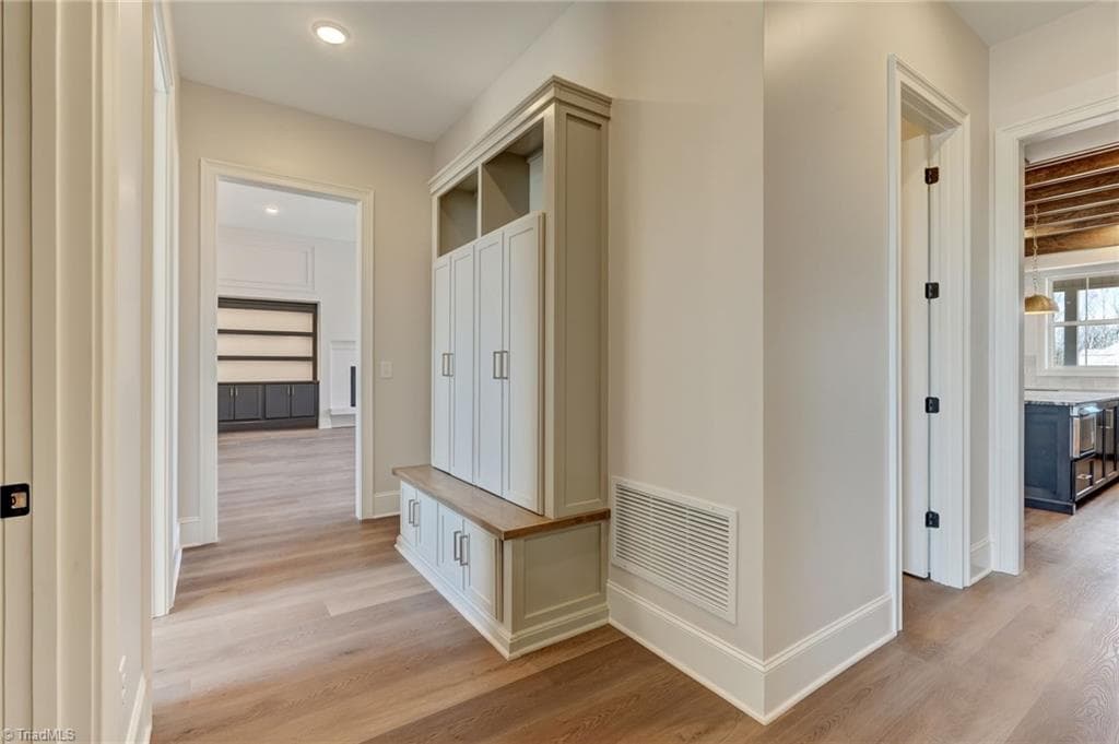 Drop zone off the garage entry featuring custom built-in organization - 7688 Kyran Court, Oak Ridge NC 27310, Oak Ridge
