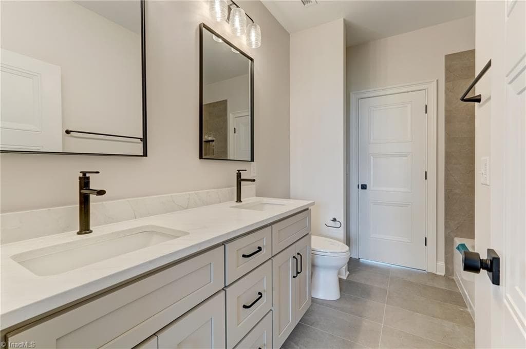 Upstairs bath with hall and bedroom access - 7688 Kyran Court, Oak Ridge NC 27310, Oak Ridge