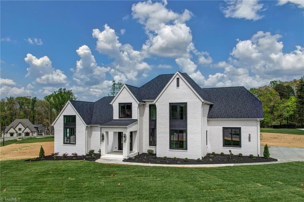 front exterior with fresh landscaping, sod and irrigation in front and seeded in back - 7688 Kyran Court, Oak Ridge NC 27310, Oak Ridge
