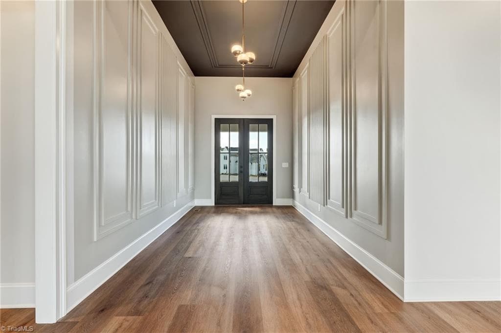 Grand foyer with 12 ft ceilings and architectural wall molding. - 7688 Kyran Court, Oak Ridge NC 27310, Oak Ridge