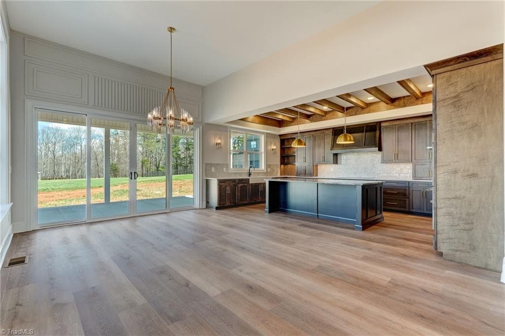 Looking into Kitchen and dining room from great room. - 7688 Kyran Court, Oak Ridge NC 27310, Oak Ridge