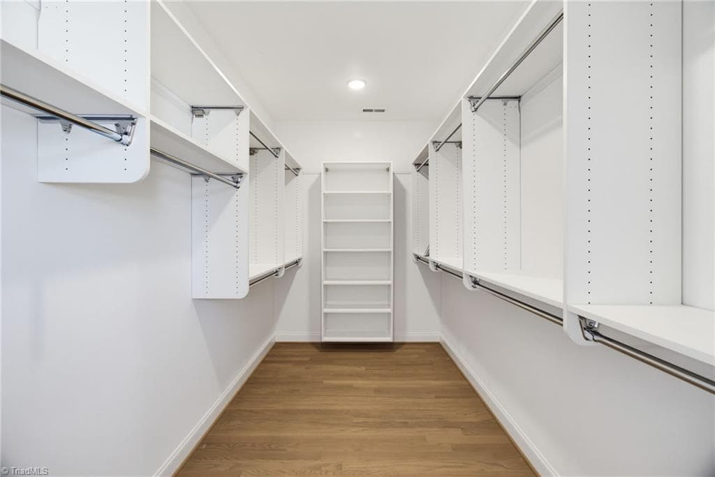 Primary closet has solid shelving - 4035 Estate Drive, Lewisville NC 27023, Lewisville