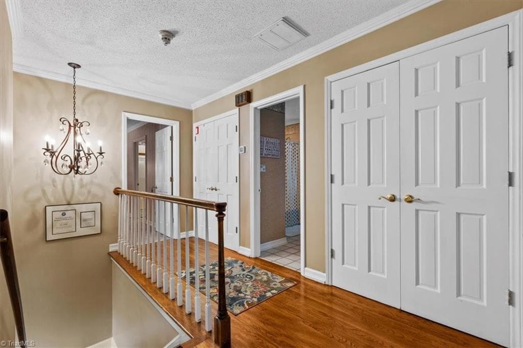 The landing above the foyer leads to the main owner suite and additional bedrooms. - 6352 Turnpike Road, High Point NC 27263, High Point