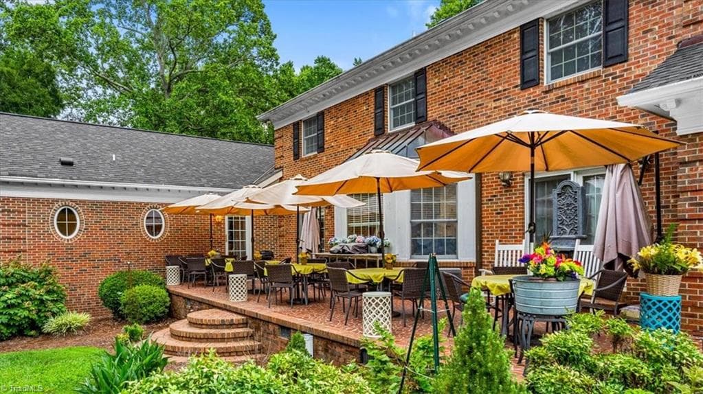 The brick paved patio is accessible from the great room, the breakfast room, and the mud/laundry room. Large enough for entertaining and relaxing. - 6352 Turnpike Road, High Point NC 27263, High Point