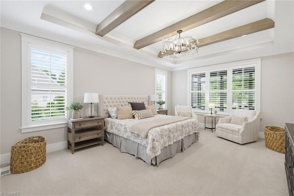 Primary bedroom with exposed beams. - 5503 Briardenn Court, Summerfield NC 27358, Summerfield