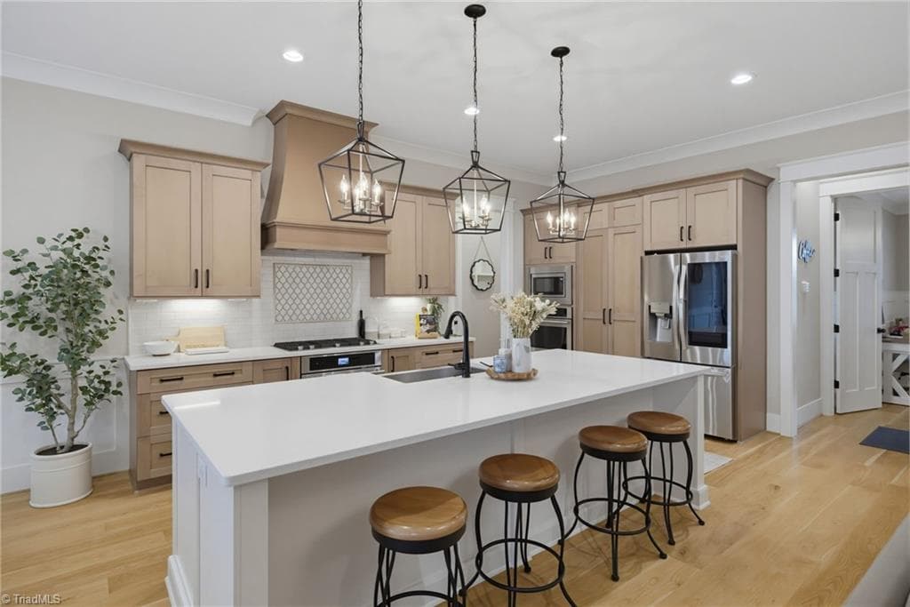 Kitchen features custom white oak cabinetry. - 5503 Briardenn Court, Summerfield NC 27358, Summerfield