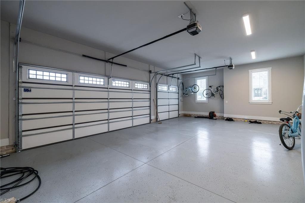 3 car garage PLUS an additional garage that can accomodate up to 4 vehicles. - 5503 Briardenn Court, Summerfield NC 27358, Summerfield