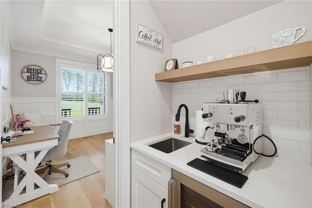 Coffee bar with beverage refrigerator. - 5503 Briardenn Court, Summerfield NC 27358, Summerfield