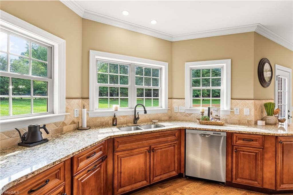 Windows in the kitchen provide so much natural light - 6202 Herons Nest Court, Oak Ridge NC 27310, Oak Ridge