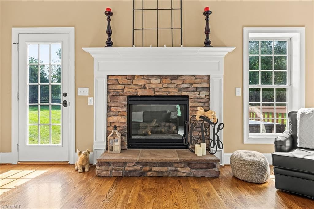 Gas fireplace-door to the left leads to the back deck - 6202 Herons Nest Court, Oak Ridge NC 27310, Oak Ridge