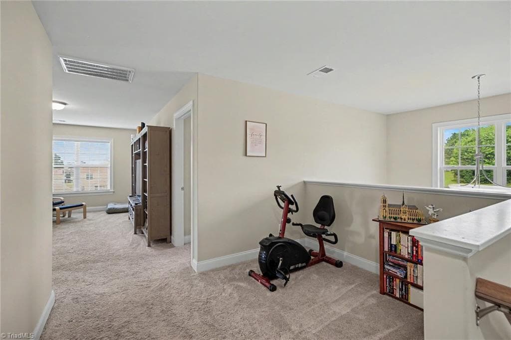 Landing at top of stairs creates a more private loft area. - 210 Marguerite Court, Reidsville NC 27320, Reidsville