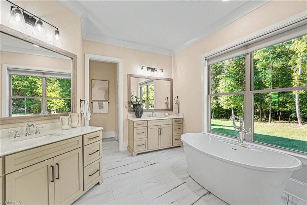 Walk-in tile shower featuring custom glass enclosure, modern fixtures, and seamless floor-to-ceiling tile work. - 1477 Cappoquin Way, Burlington NC 27215, Burlington