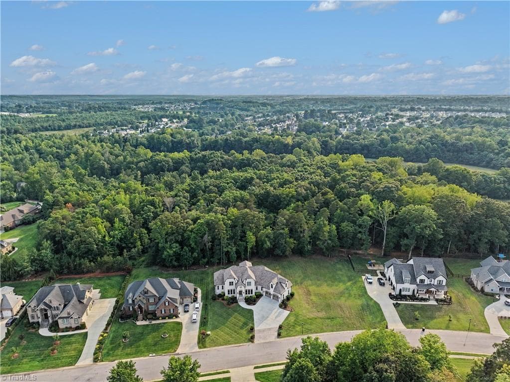 Beautifully positioned within Waterford West, this home offers exceptional curb appeal and architectural presence. - 1477 Cappoquin Way, Burlington NC 27215, Burlington