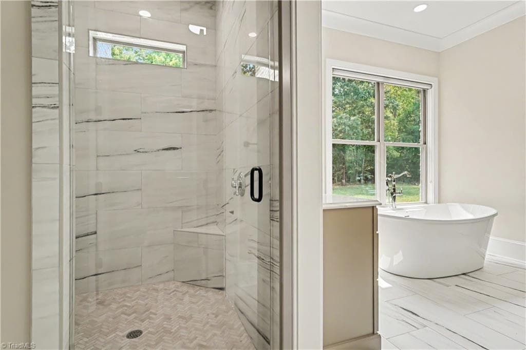 Spacious walk-in closet featuring custom built-in shelving. - 1477 Cappoquin Way, Burlington NC 27215, Burlington