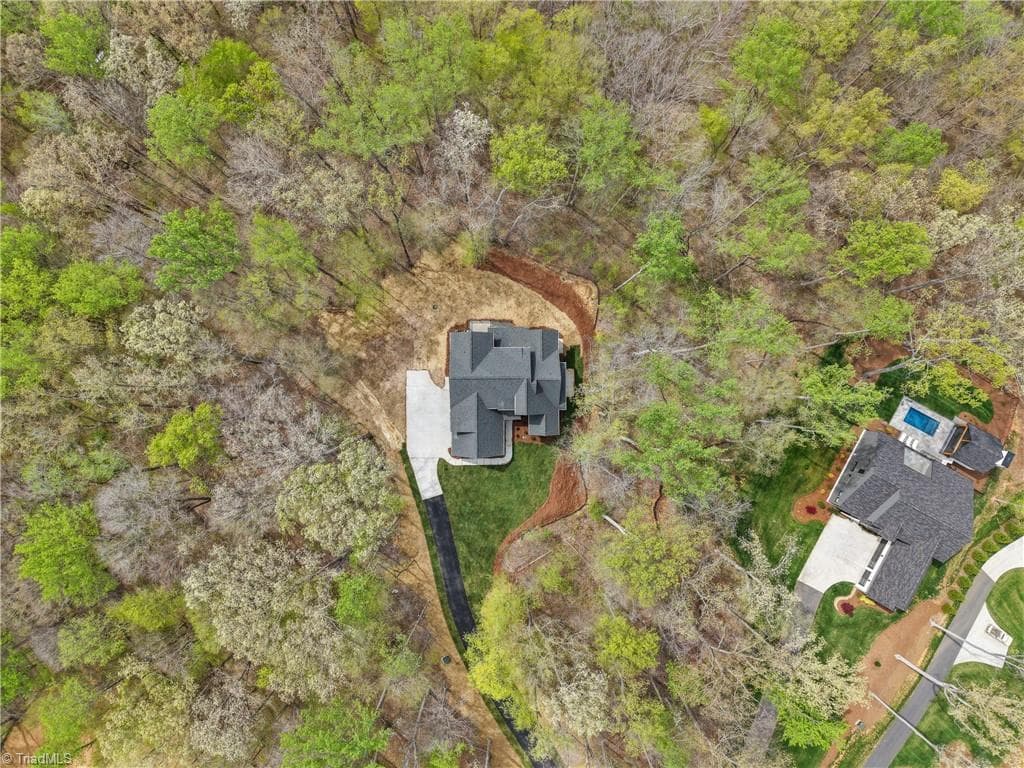 A truly exceptional homesite offering unmatched privacy, natural beauty, and a tucked-away setting surrounded by trees. - 9664 Lissara Camp Court, Lewisville NC 27023, Lewisville