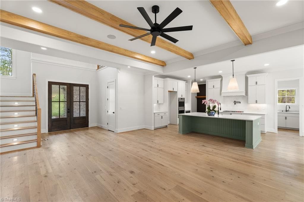 Open-concept living with seamless flow from the great room into the kitchen and foyer. - 9664 Lissara Camp Court, Lewisville NC 27023, Lewisville