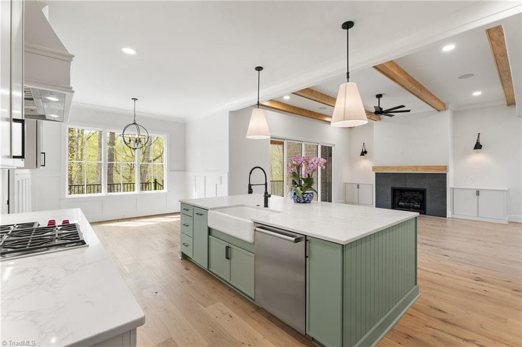 Imagine cooking in this beautiful kitchen while enjoying peaceful wooded views. - 9664 Lissara Camp Court, Lewisville NC 27023, Lewisville