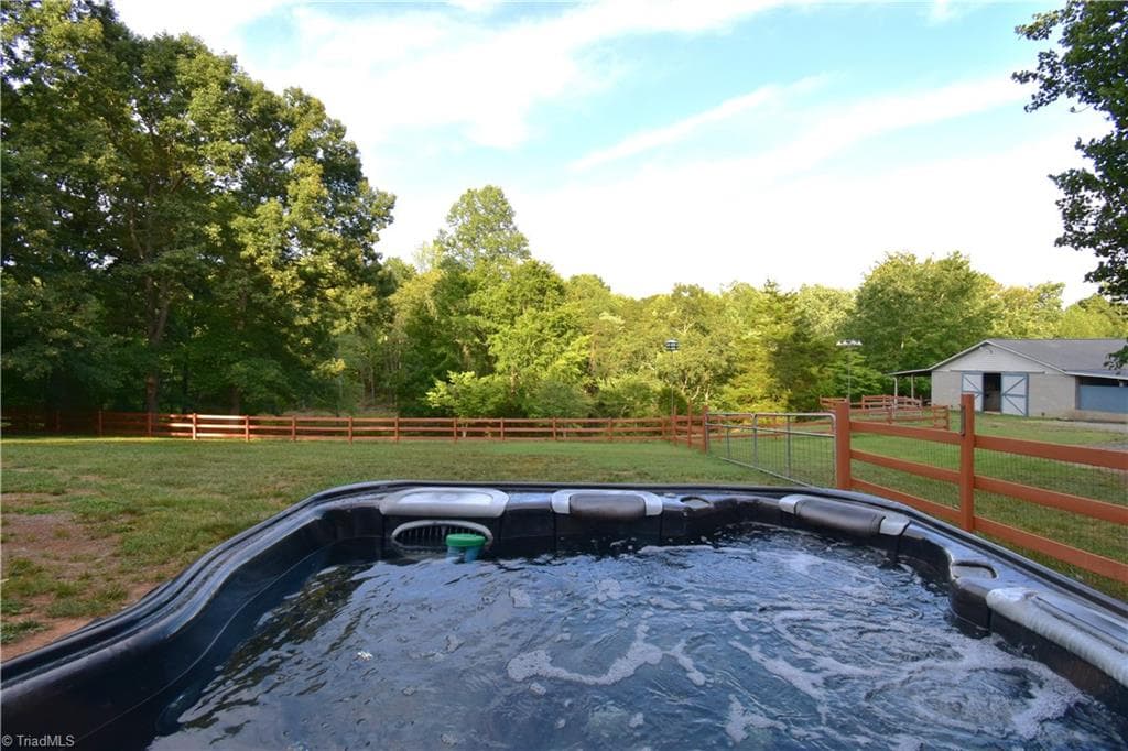 Relaxing after a day of riding and playing in the out doors. This is a view you could get used to very quickly. - 8546 Hudson-James Road, Summerfield NC 27358, Summerfield