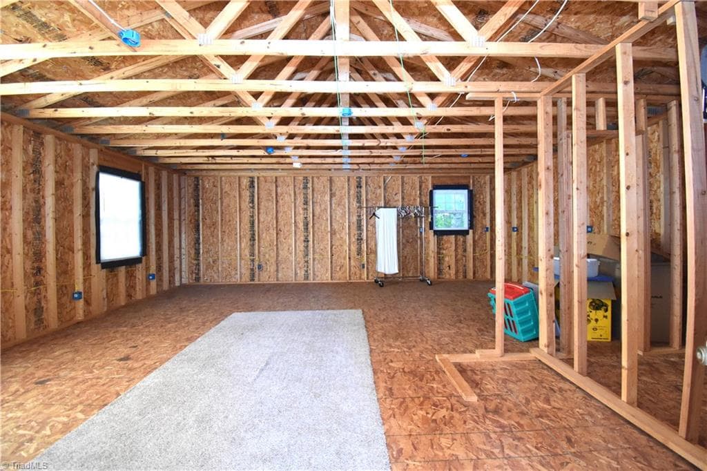 Upstairs of the unfinished in-law suite, could be finished as originally intended or used as an office/teen space or simply more storage. - 8546 Hudson-James Road, Summerfield NC 27358, Summerfield