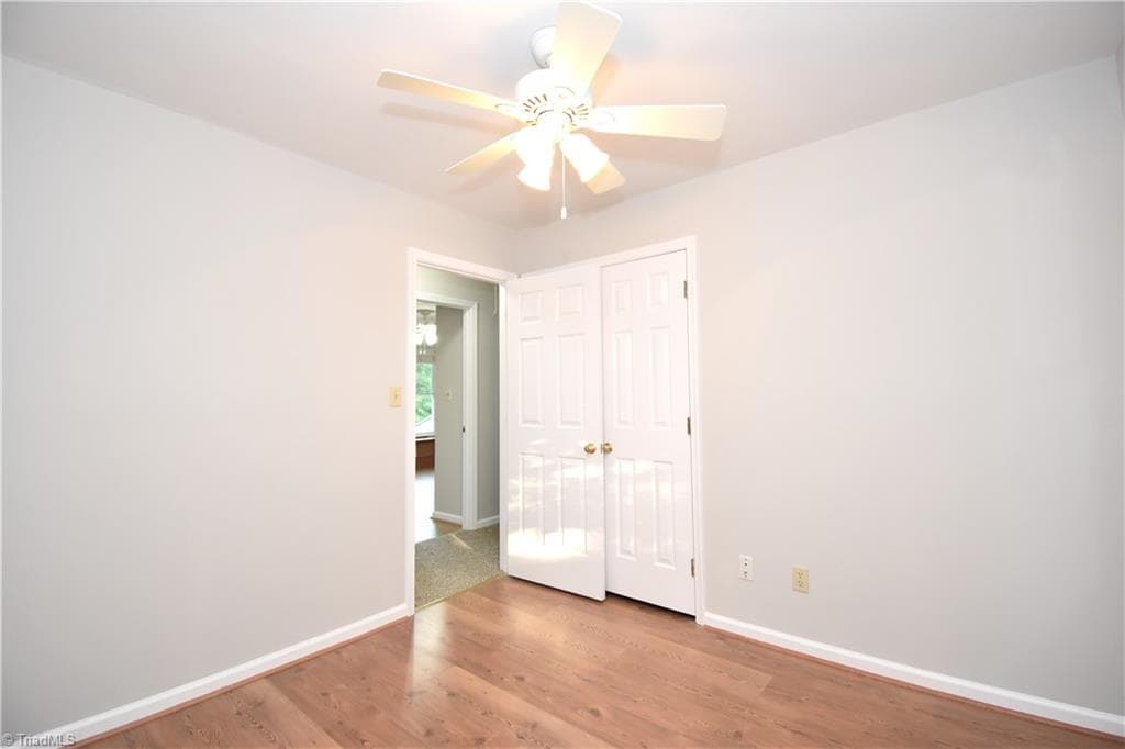 A second view of the first guest bedroom. - 8546 Hudson-James Road, Summerfield NC 27358, Summerfield
