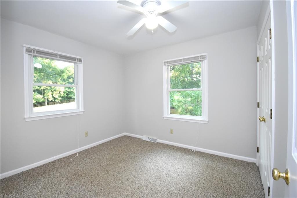 A second view of the second guest bedroom. I wonder what is outside the window??? - 8546 Hudson-James Road, Summerfield NC 27358, Summerfield