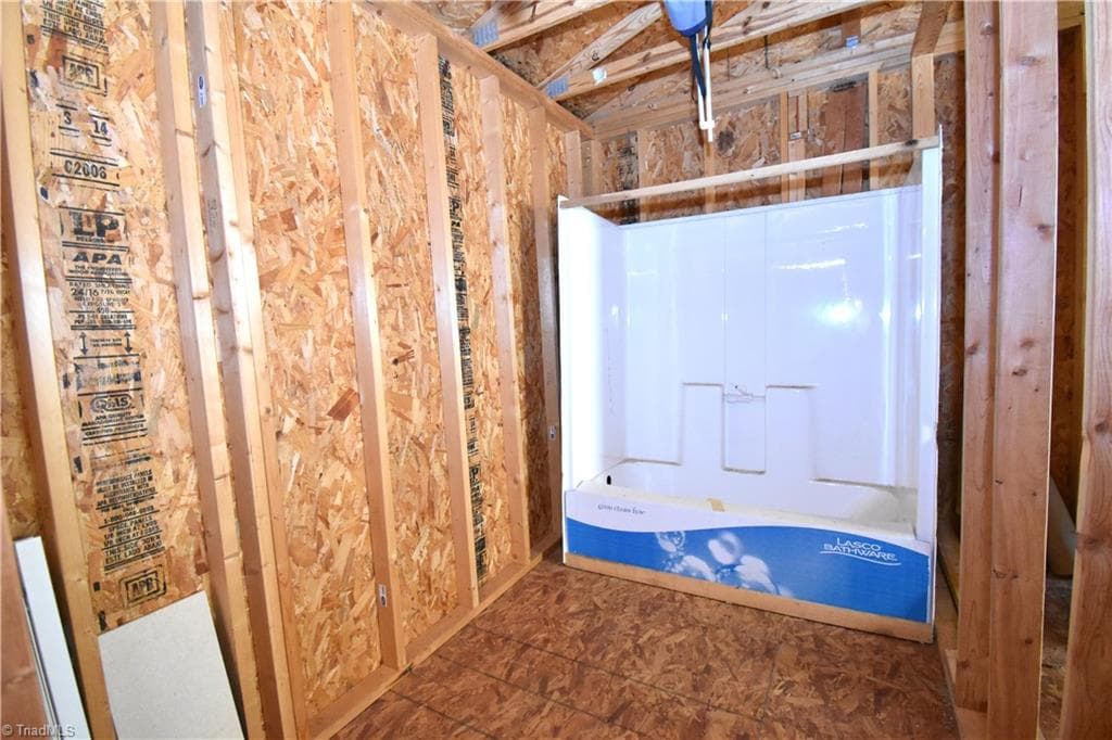 The unfinished bathroom has its own shower. - 8546 Hudson-James Road, Summerfield NC 27358, Summerfield