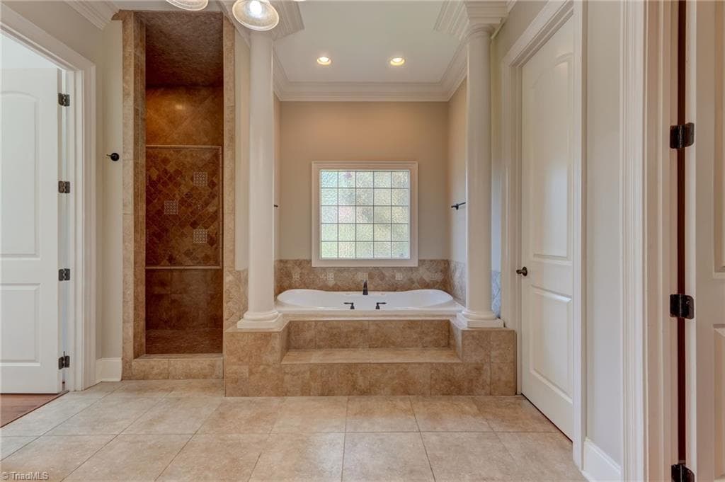 Luxurious spa inspired en suite bath. Large walk in shower. Jetted tub. Dual walk-in closets. - 4404 Liguria Court, Summerfield NC 27358, Summerfield