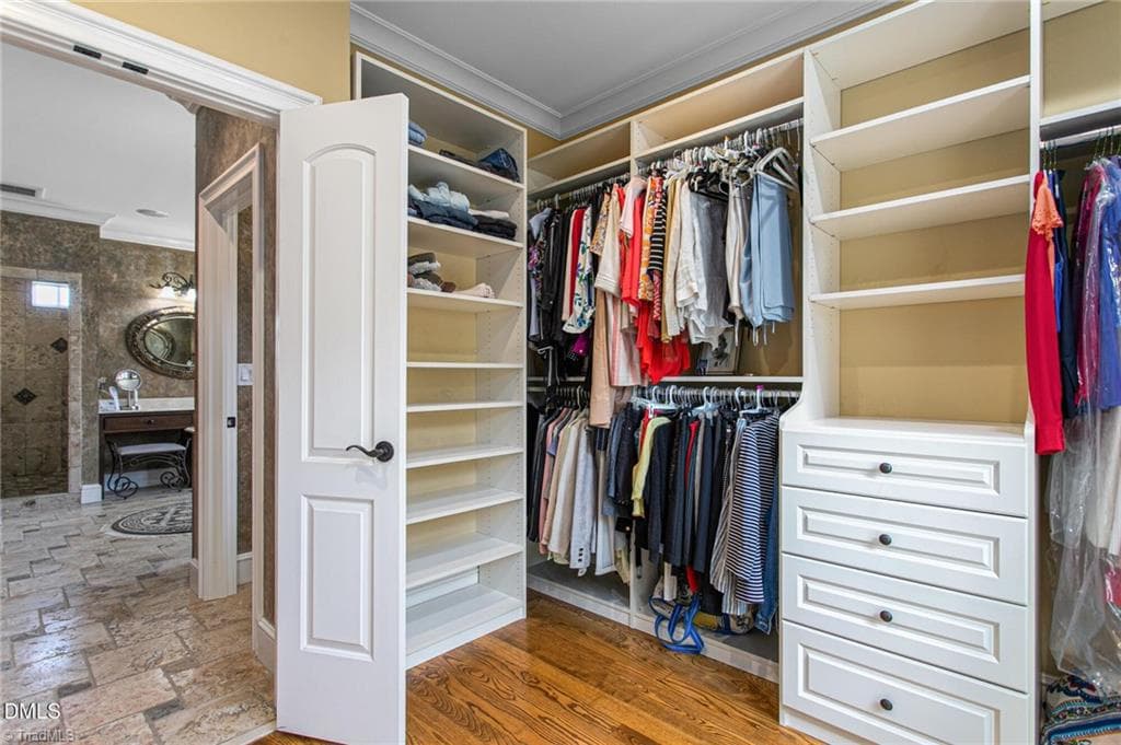 Primary closet with custom organizer and drawers - 841 Dunleigh Drive, Burlington NC 27215, Burlington